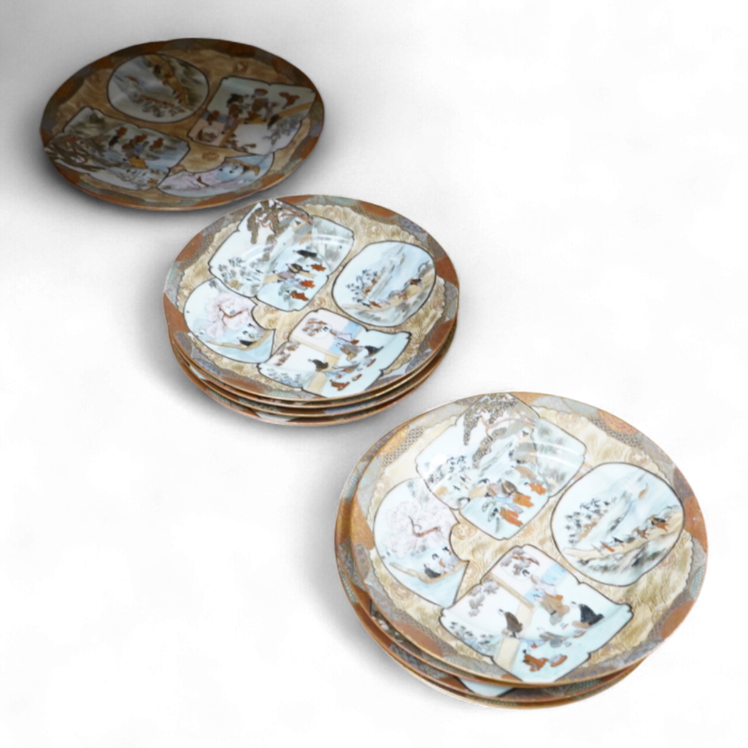 A set of nine early 20th century Japanese Kutani plates, largest 21.5cm